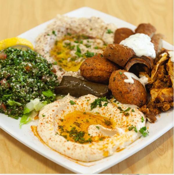 Meat Mezza with Pita Bread · Hummus, baba ghanoush, tabbouleh, falafel and grape leaves, chicken shawarma and gyro meat.