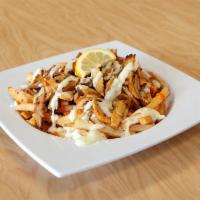 Loaded Fries with Chicken Shawarma and house garlic sauce · .Basket of fries loaded with tender vertically grilled boneless  spiced  marinated chicken  ...