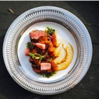 Hanger Steak · 6oz hanger steak w/ roasted baby carrots, spiced strawberries, carrot romesco, & quick pickl...