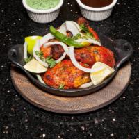 Chicken Tandoori · Chicken marinated with yogurt and spices.