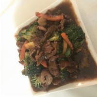 Beef Broccoli · Sliced beef stir-fried in brown sauce w/ broccoli, water chestnut and carrot.
