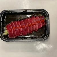 Tuna Tataki · Raw. Sliced seared tuna with ponzu sauce, tobiko, and little Sriracha.