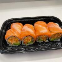 Playboy Roll · Spicy crab avocado topped with salmon. Raw.