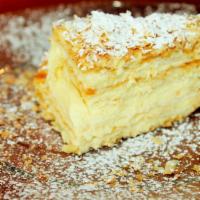 Russian Napoleon · Layers and layers of puff pastry and sweet vanilla bean pastry cream, topped with confection...