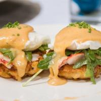 Lobster Benedict · Baked lobster, topped with poached organic eggs herb Hollandaise sauce, hash brown and house...