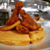 Southern Chicken and Waffles · Wedges topped with fried chicken tenders, chopped bacon, sweet dried cranberries and our own...