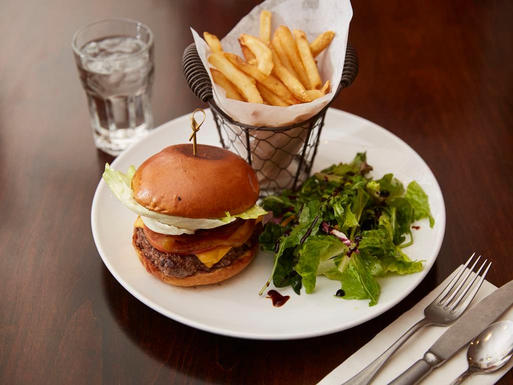 The Corner  Burger · Cheeseburger with organic Angus beef, caramelized onions, tomatoes, lettuce pickles and homemade sauce.