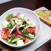 Greek Salad · Chopped romaine lettuce, tomatoes, cucumbers, cucumbers, green peppers, feta cheese, onions,...