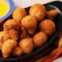 Fried Mushrooms · Breaded mushrooms served with chile con queso and jalapeno ranch for dipping.