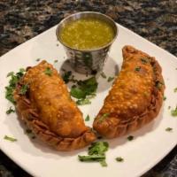 Empanadas · Two hand filled empanadas with Mexican cheeses and your choice of filling. Served with a sid...