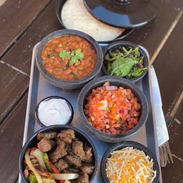 First Responder Fajitas · caramelized peppers and onions, blended Mexican cheeses, Pico de Gallo with flour tortillas and choice of Portabllo, Chicken, Carna Asada or Shrimp.

Served with three warm tortillas with a side of rice, beans, and guacamole