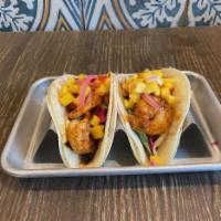 Thai Shrimp Tacos · Pad Thai sauce with our cabbage slaw, peanuts and sesame seeds