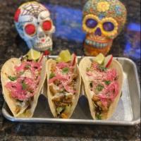 Chicken Tacos · Our chicken mix with pickled red onion, Lime crema, Cotija and cilantro
