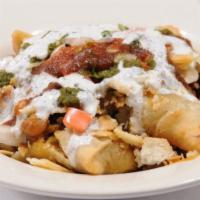 Samosa Chaat · 2 pieces vegetable samosa, chickpeas, onion tomato, topped with mint sauce and tamarind sauce.