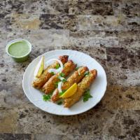 Chicken Seekh Kabab 4 pieces · Minced chicken seasoned with chopped onions, herbs and spices, cooked on skewers in a clay o...
