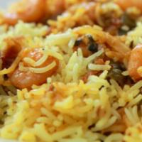 Shrimp Biryani · Shrimp marinated flavored with spices cooked with basmati rice. It is served with raita.