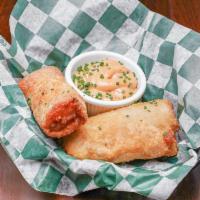 Reuben Rolls · Corned beef, sauerkraut, swiss cheese in an egg roll - served with thousand island dressing.