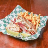 Classic Reuben · Traditional corned beef, sauerkraut, swiss cheese, thousand Island dressing, marble rye. - s...