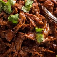 Savory Beef a la carte · Marinated & cooked in a root beer and BBQ sauce blend, topped with fresh cut cilantro - on c...