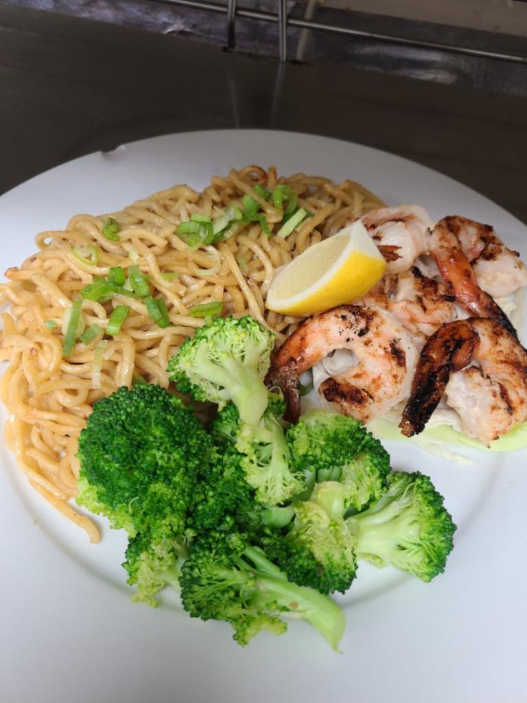 Garlic Prawns with Garlic Butter Noodles Special · Garlicky grilled prawns paired with stir fried chewy garlic butter yakisoba noodles. Comes with a side of broccoli