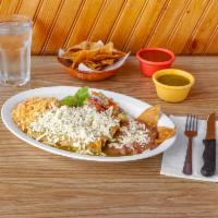 Enchiladas Verdes Anejas  de Papa · 4 dipped tortillas in special green sauce filled with potatoes topped with fresh crumbled ch...