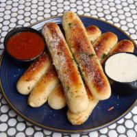 Garlic Breadsticks · Warm breadsticks, garlic butter, romano cheese, marinara and ranch or giardiniera ranch.