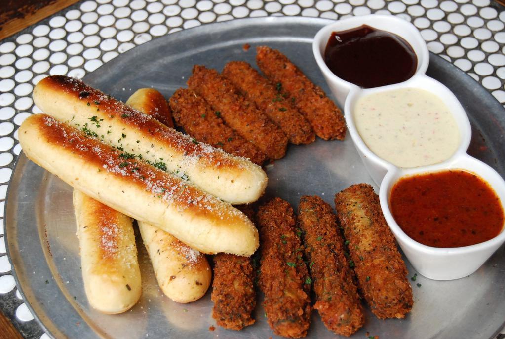 Sticks and Dips · 4 garlic breadsticks, 4 mozzarella sticks and 4 spinach sticks served with choice of 3 dipping sauce.