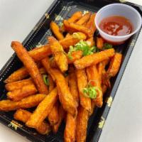Sweet Potato Fries · Sweet potato fries with housemade sweet and spicy ketchup.