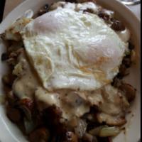 Country Skillet · Herb red potatoes topped with sausage, sauteed onions & mushrooms, country gravy & 2 eggs.
