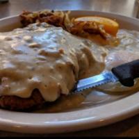 Chicken Fried Steak and Eggs · Topped with country gravy, served with potatoes & toast.