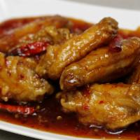 6 Chicken Wings · Comes with your choice of wing sauce.