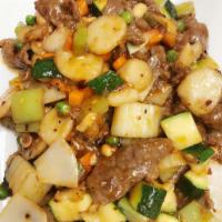 Kung Pao Beef · Thick-sliced beef steak stir-fried with peanuts, chili peppers, peas, carrots, zucchini, wat...