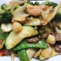 Happy Family · Stir-fry combination of shrimp, chicken, beef, scallop and vegetable. Served with choice of ...