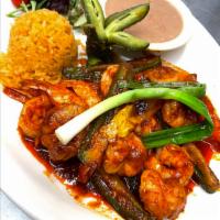 Fajitas Fuego de Pollo  · Marinated strips of chicken breast sautéed with jalapeños, serrano peppers, grilled onions, ...
