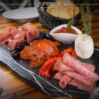 Tavolo di Antipasti · Prosciutto, speck, chorizo, salami, fresh mozzarella, Kalamata olive, roosted peppers and ar...