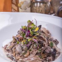 Porcini and Mushroom Cream Pasta · Porcini mushroom, portobello and fresh mushroom tossed in a creamy sauce, white wine and tru...