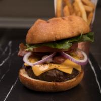 Classic Burger · Burger with American cheese, red onion, tomato, Romaine lettuce, and crispy bacon. Served wi...