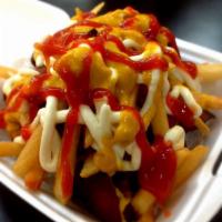 Salchipapas · Dish of cut-up fried hot dogs and french fries served with your favorite sauces. 