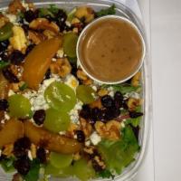 Bistro Salad · Field greens, seedless grapes, sun-dried cranberries, blue cheese, candied walnuts and slice...