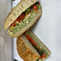 Pesto Chicken Sandwich · Fresh mozzarella, sauteed spinach, roasted tomatoes, red peppers and spicy hummus.