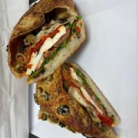 Fresh Mozzarella Sandwich · Fresh basil, baby arugula, sweet peppers, roasted tomatoes and sun-dried tomato pesto. Veget...