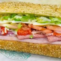 Italian Submarine Sandwich · Beef salami, turkey, ham, provolone, Romano, tomatoes, peppers, onions and lettuce with a dr...