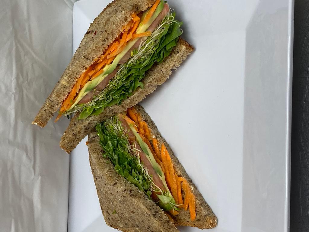 Vegetarian Sandwich · Avocado, tomatoes, arugula, alfalfa sprouts, carrots and spicy hummus.
