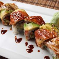 Dragon Roll · Shrimp tempura, crab and cucumber inside, eel and avocado rolled outside.