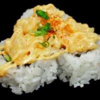 Monkey Roll · Spicy crab salad, cucumber, avocado, topped with spicy creamy white tuna