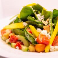 Lilly's Salad · Baby spinach, cucumber, mango, hearts of palm, cherry tomatoes, goat cheese, ginger lime dre...