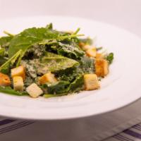 Kale Caesar Salad · Tossed with a homemade dressing and garlic croutons.