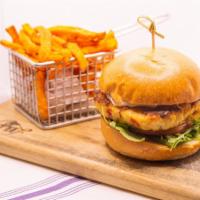 Crabcake Burger · 8oz homemade crabcake with arugula, tomato and lemon caper aioli. Served with sweet potato f...