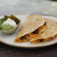 Quesadillas Appetizer · Beef or chicken fajita served with guacamole, sour cream and jalapenos.