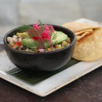 Tropical Ceviche · Macerated fish and shrimp in lime juice with charred pineapple, red bell pepper, jalapenos, ...